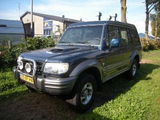 krockskadad bil bedrijf Hyundai Galloper 2.5 TCI High Roof exceed uitvoering met oa airco, 4wd enz 2002/8