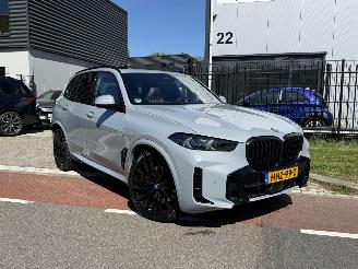 Schadeauto BMW X5 xDrive50e HUD - SKYLOUNGE - IONIC GLOW - BOWERS&WILKINS 2024/2